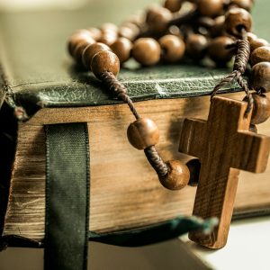brown tesbih prayer beads on black book